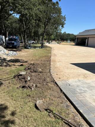 Sprinkler repair near new driveway