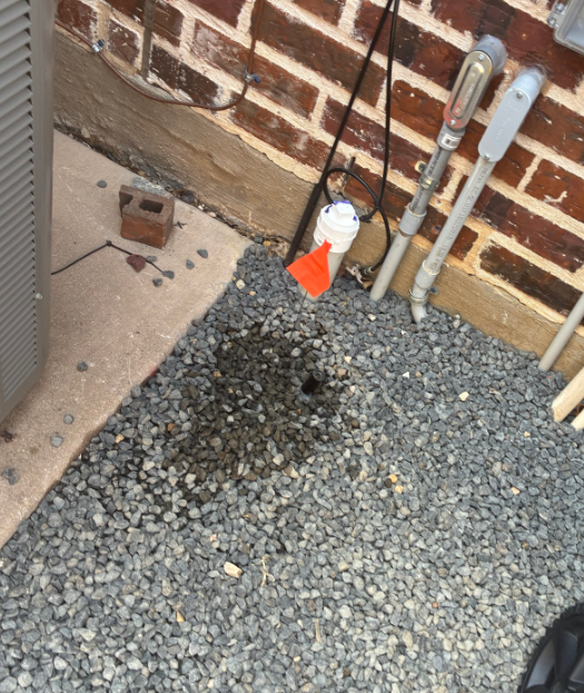 located sprinkler head buried under landscape rocks